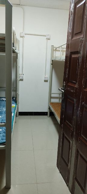 Quiet bed, and another independent unit near the Olympic Station. The bed is in a room with a brick
