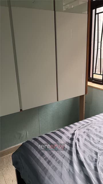 Large bedroom and lobby on the 7th floor of the Ocean View Building -
